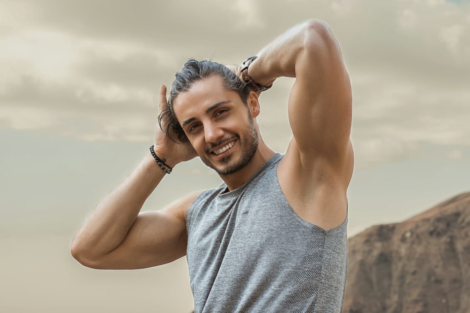 A man smiling after training, representing the LovMedSpa men's health experience