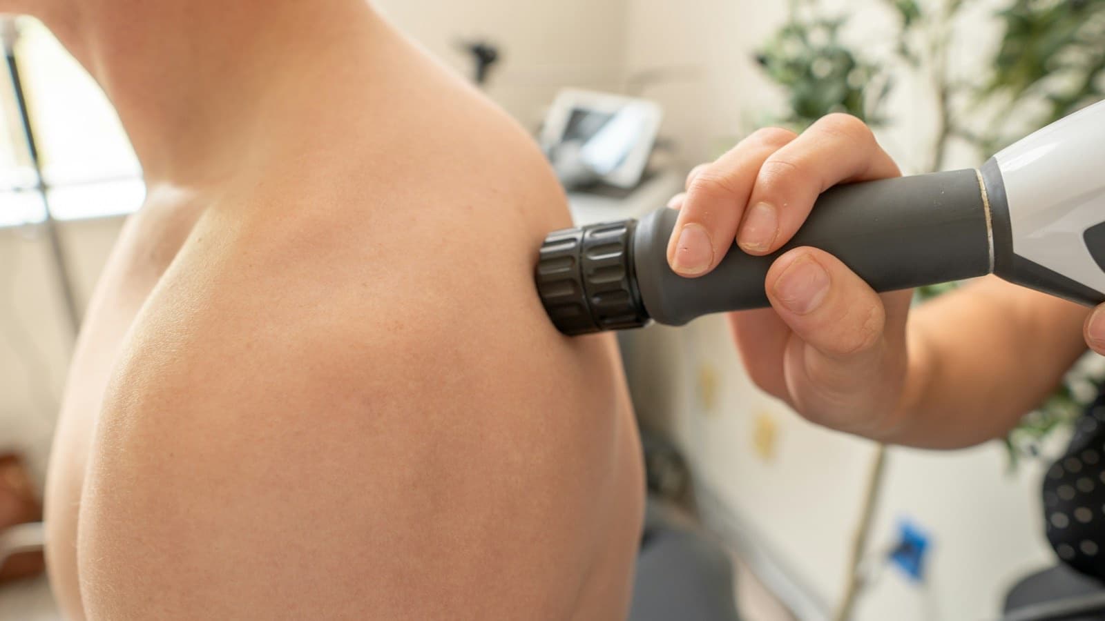 Low-intensity shockwave therapy handpiece in use at LovMedSpa
