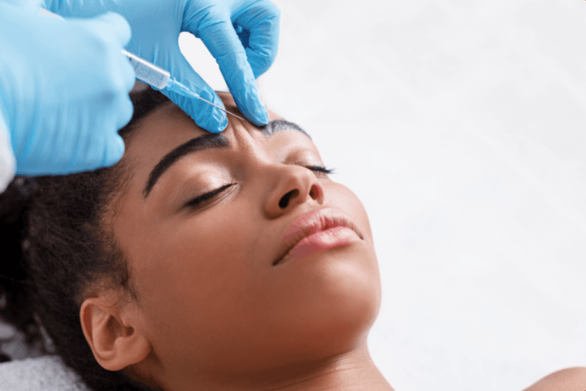 LovMedSpa injectable treatment performed by a provider wearing blue gloves
